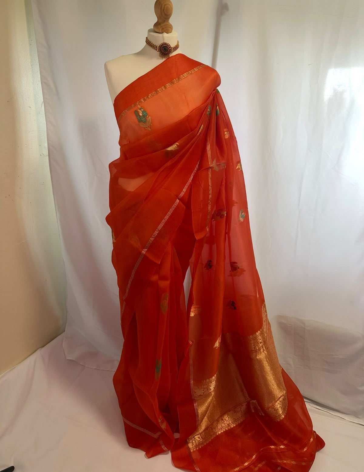 Orange Banarasi Organza Saree with Gold Zari & Floral Motifs