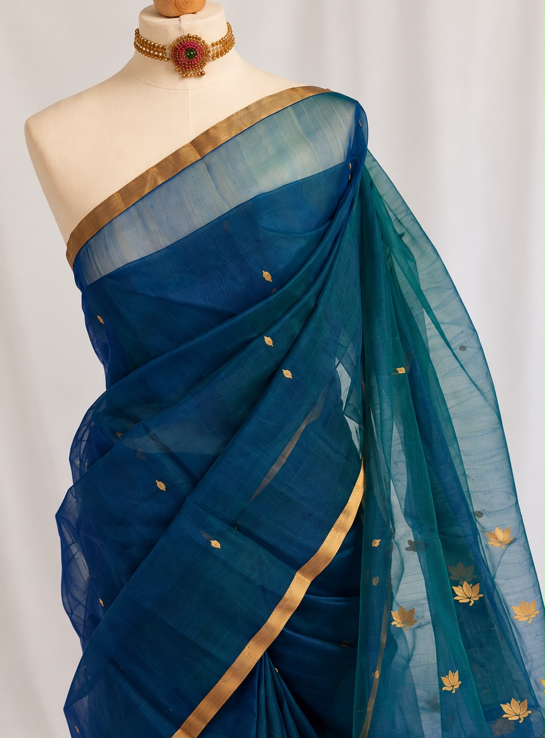 Maheshwari Silk Saree in Teal with Gold Lotus Motifs & Zari Border